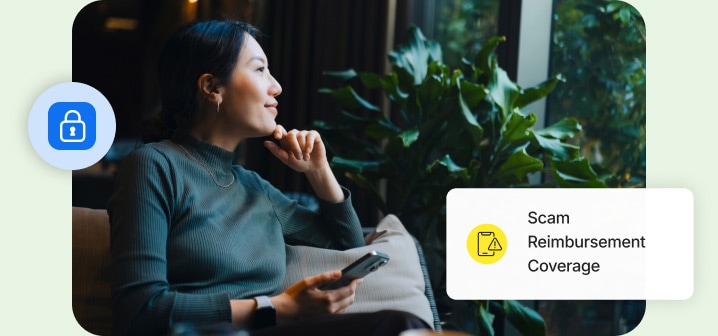 Woman smiling holding a mobile phone