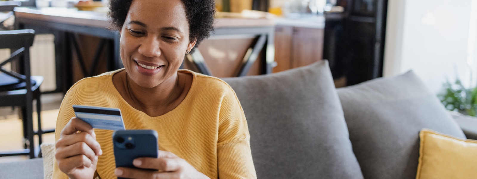 A person using their phone to make a payment on a cash app, illustrating the potential for scams and how to protect yourself from them.