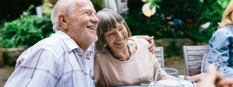 Elderly couple learning about the top 5 scams targeting seniors.