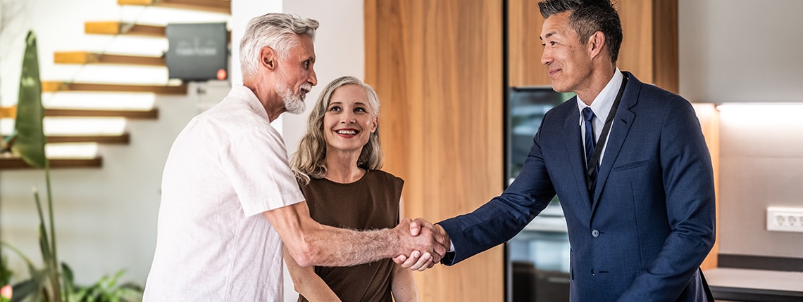 A couple tours homes after learning how to buy a house with bad credit.