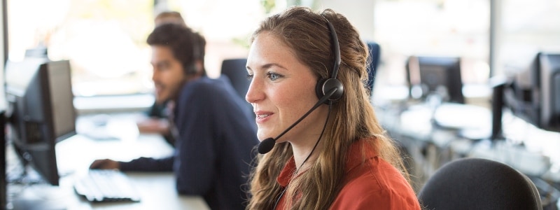 LifeLock Identity Restoration Specialists seen answering a call from a customer.