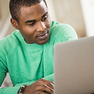 Man looking at a laptop