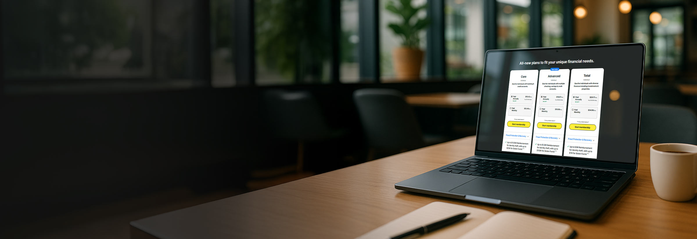 A laptop open on a webpage showing the three new LifeLock plans: Core, Advanced, and Total.