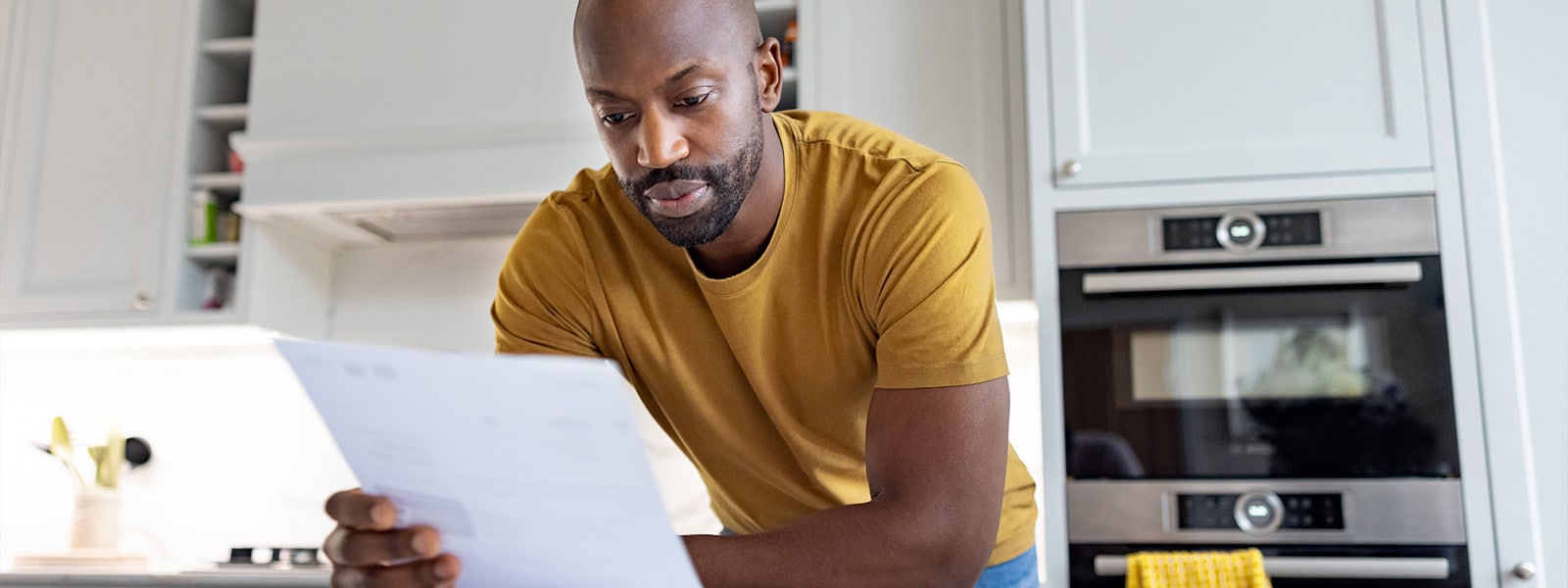 A person reading about how synthetic identity theft works.