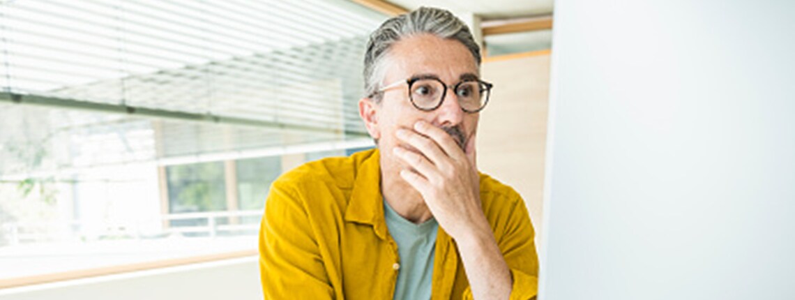 A person reading about how identity thieves could use their information.