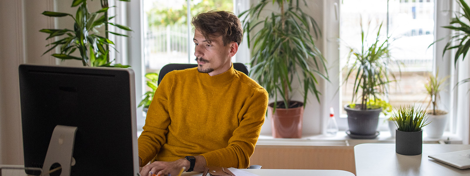 A person researching “What are the 3 credit bureaus?” on their computer.