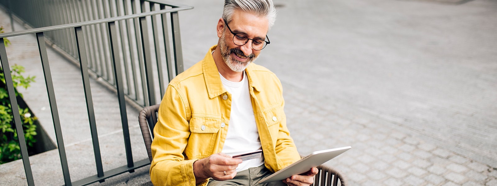 Man looking at a pre-approved credit card.