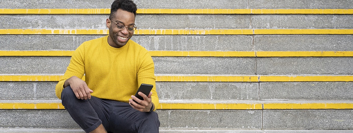 A person using a phone to protect their data privacy, illustrating the importance of data privacy in the digital age.