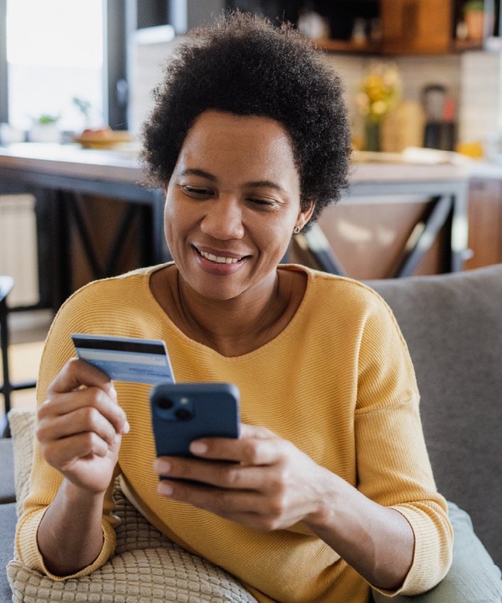 A woman makes a safe app payment after learning about Cash App scams.