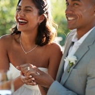 Picture of married couple at their wedding holding hands.