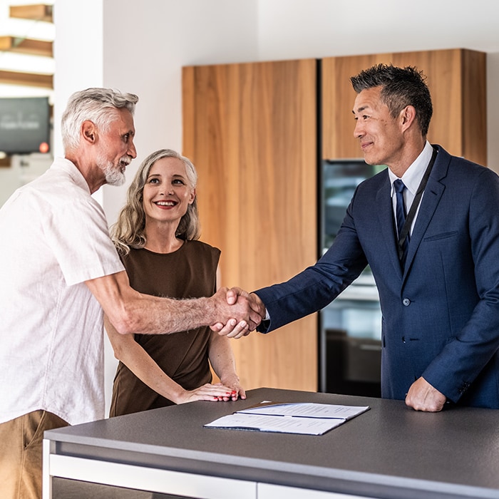  A couple tours homes after learning how to buy a house with bad credit.