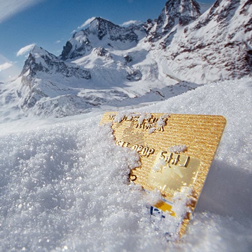 A snow-covered credit card symbolizing a credit freeze.