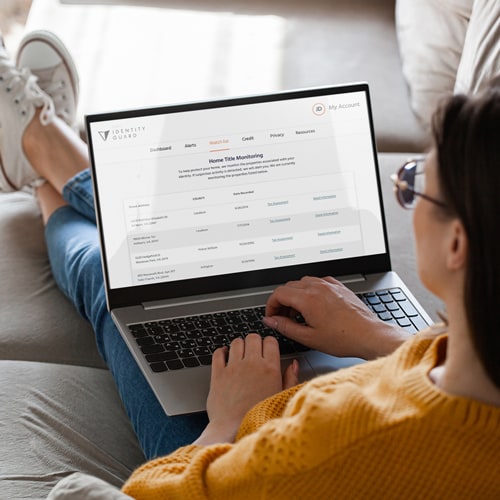 A person viewing the Identity Guard website on their computer.