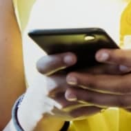 Woman viewing a mobile device.