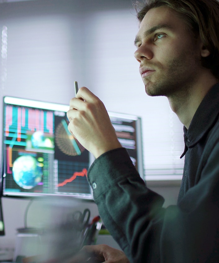 A man sitting at a desk to take action after a data breach.