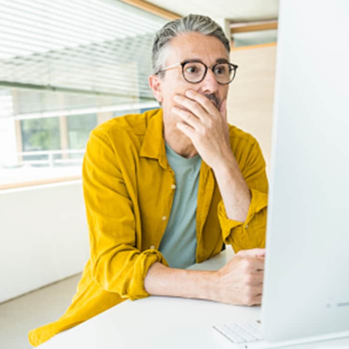 A person reading about how identity thieves could use their information.
