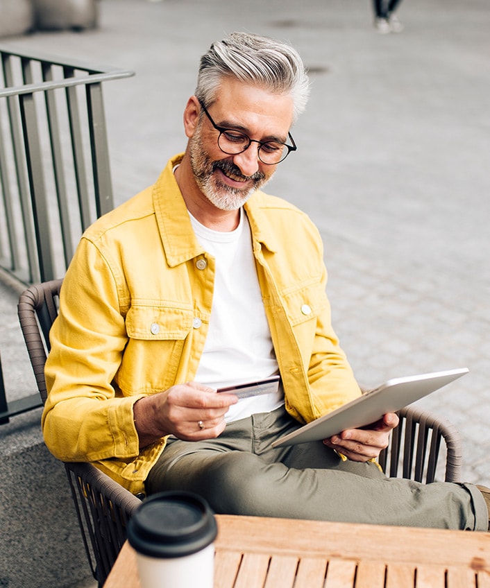 Man looking at a pre-approved credit card.