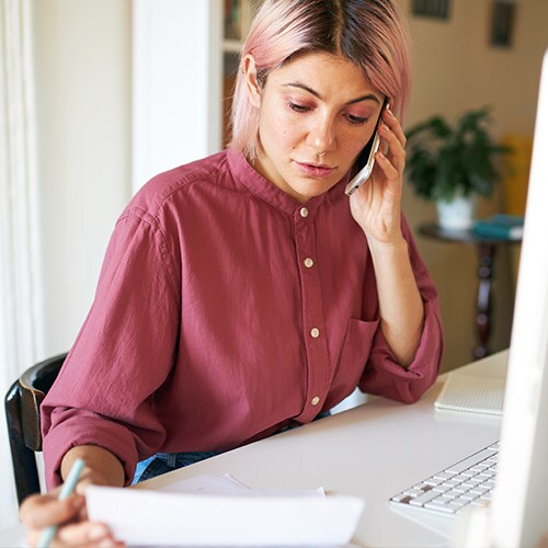 A woman uses her laptop and wonders what to do if your identity is stolen.